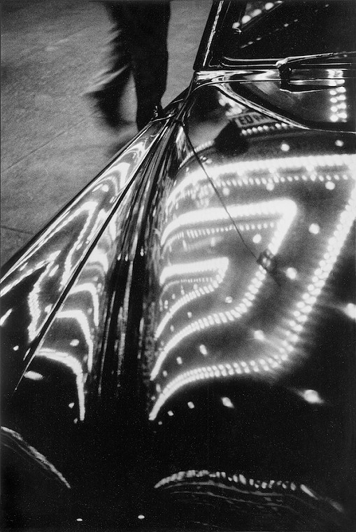 Harold Feinstein, Times Square Lights Reflected on Car, New York, 1953