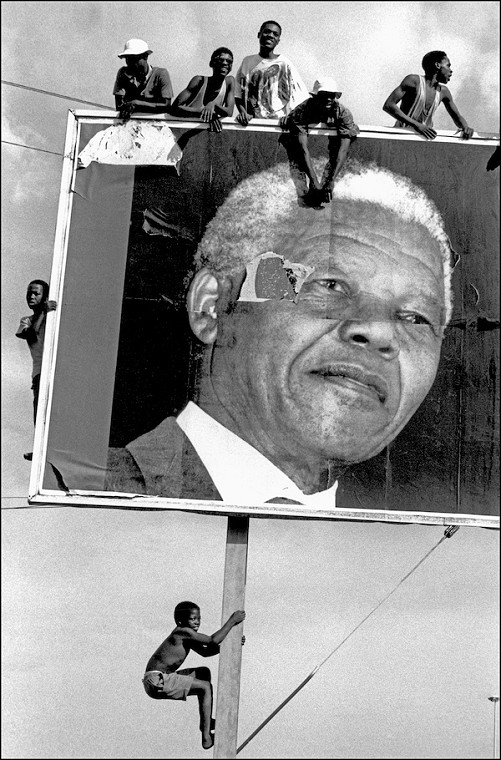 Supporters climb to every vantage point while awaiting the arrival of Nelson Mandela,1994
